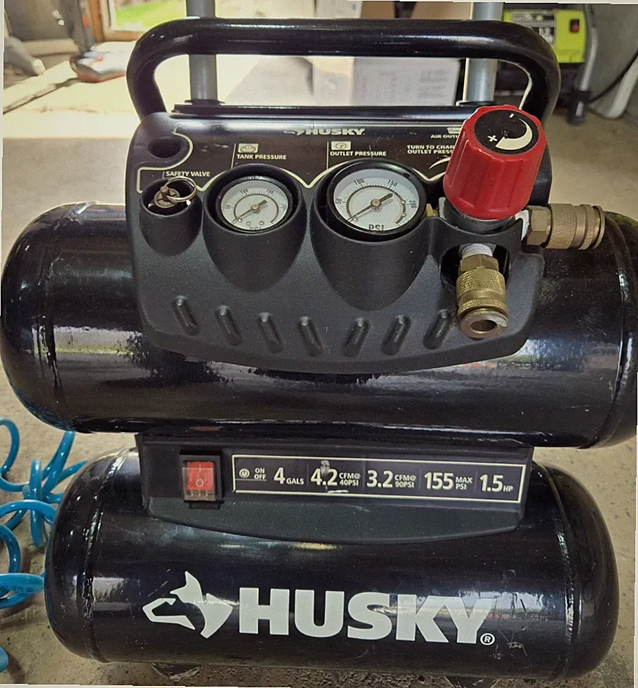 Husky Air Compressor 4 Gallons with Air Hose and A Few Attachments Included